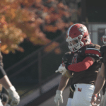 College football team receiving a play call on their wearable GoRout Gridiron devices